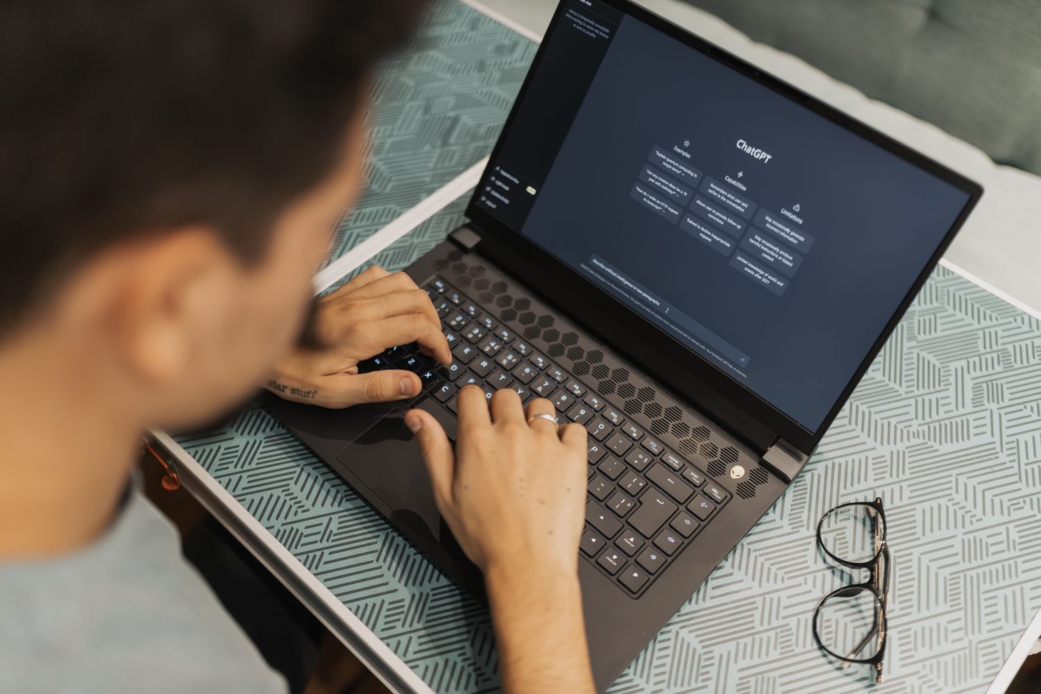 A person using an AI assistant on a laptop