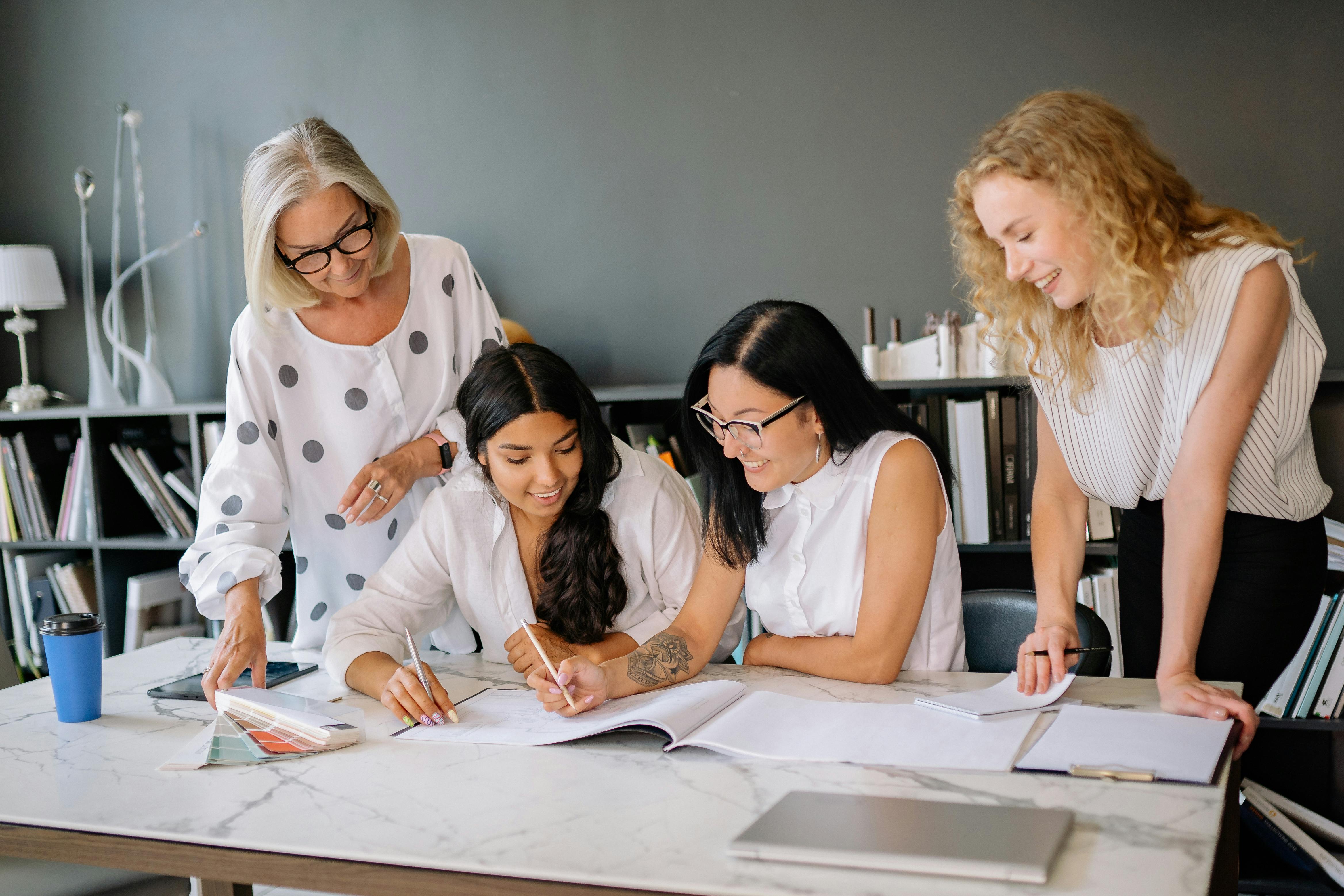 A collaborative product team discussing ideas around a shared table
